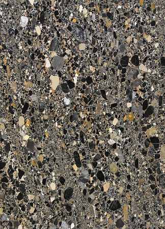 Close-up of textured stone surface in various colors.