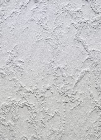 Textured white plaster wall surface close-up