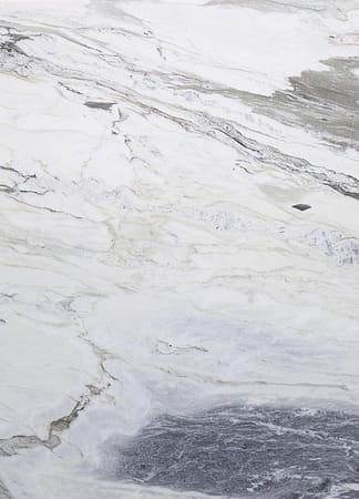 Natural marble texture with gray and white veins.