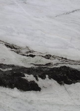 Close-up of textured black and white marble surface.