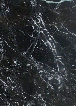 Dark marble texture with white veins.