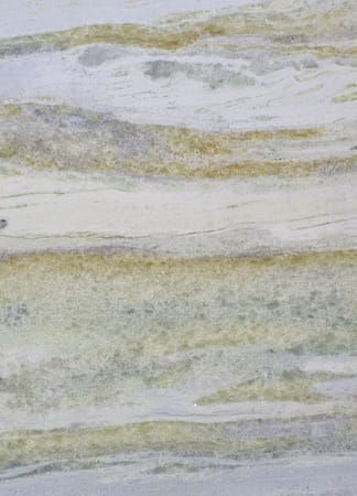 Polished marble stone with green and beige veins