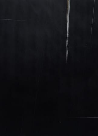 Abstract black surface with vertical brown lines