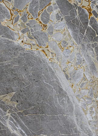 Close-up of gray marble surface with veining.