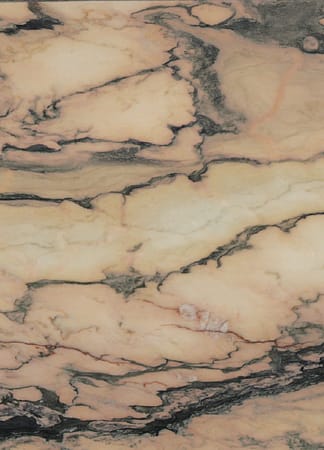 Close-up of marbled stone texture with pink veins.