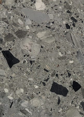 Close-up of gray marble texture with black specks.