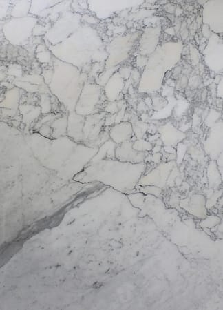 White marble texture with gray veins.