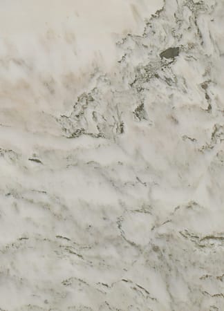 Textured white marble surface with gray veins.