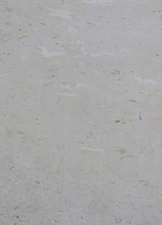 Close-up of light gray textured stone surface