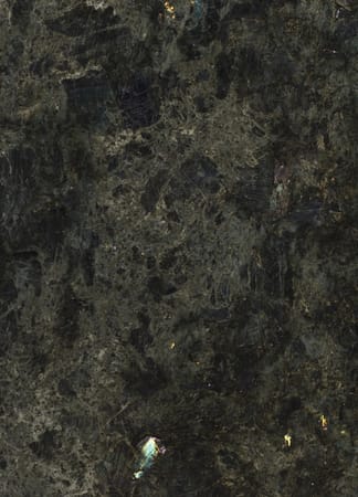 Dark granite stone texture with reflections