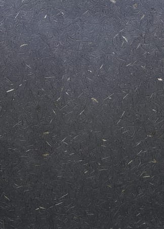Close-up of textured gray surface with scratches.