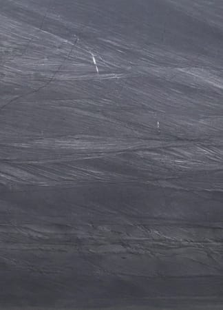 Gray textured stone surface with natural patterns