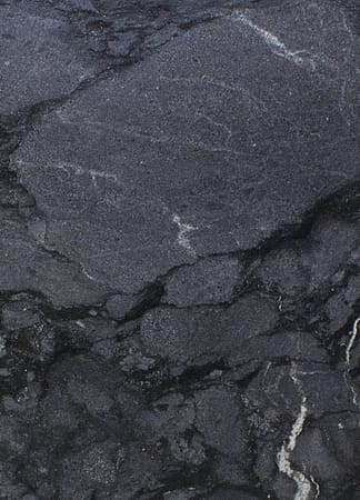 Black marble texture with white veins.