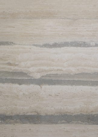 Beige marble surface with horizontal striations.
