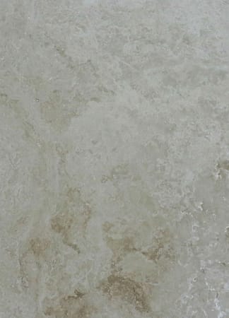 Textured beige marble surface detail.