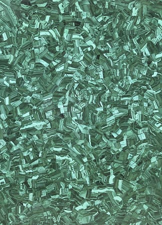 Textured green malachite gemstone surface background