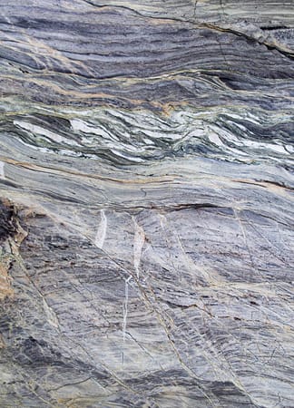 Close-up of textured stone surface with natural patterns.