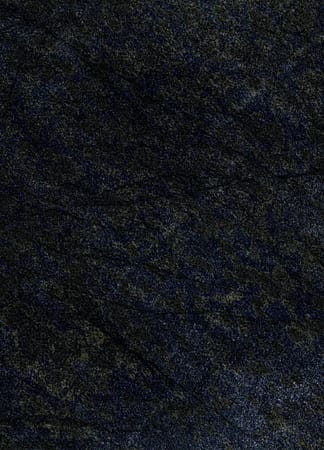 Dark textured stone surface