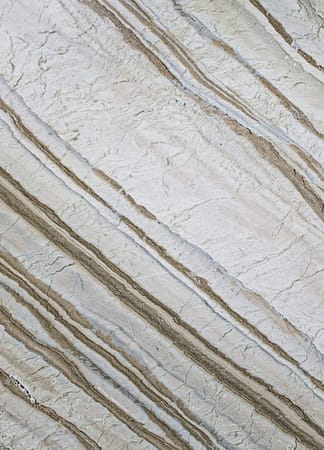 Close-up of textured stone surface with lines.