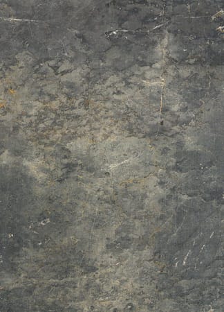 Close-up of dark, textured stone surface.