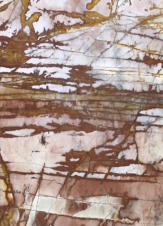 Colorful marble texture with veins and patterns.