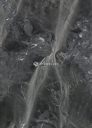 Dark marble surface with white veining patterns.