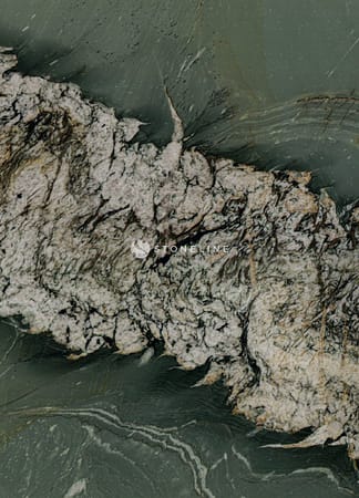 Close-up of textured green stone surface