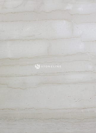 Close-up of beige marble texture with veins.