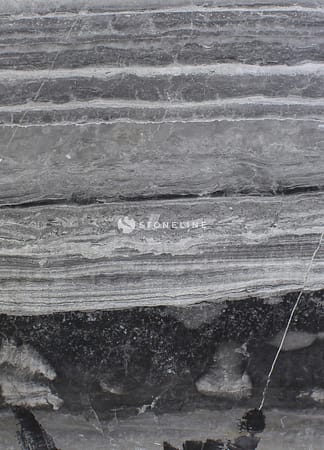 Close-up of layered gray stone texture