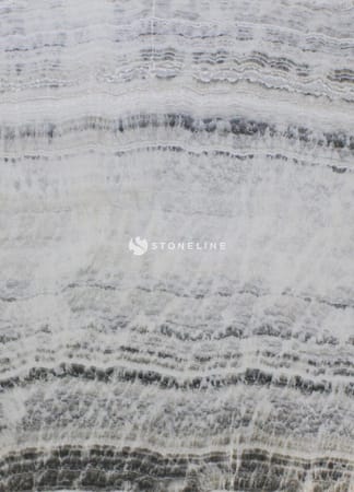 Close-up of textured gray and white marble surface.