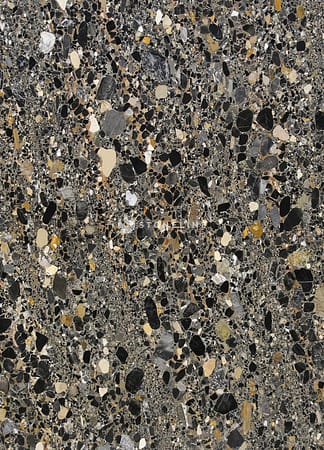 Close-up of textured stone surface in various colors.