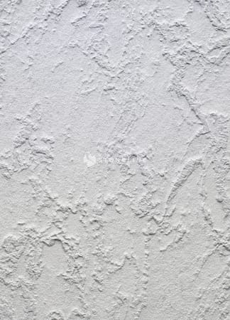 Textured white plaster wall surface close-up
