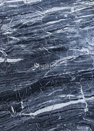 Close-up of textured dark gray marble surface.