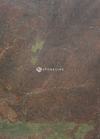 Close-up of textured brown and green stone surface.