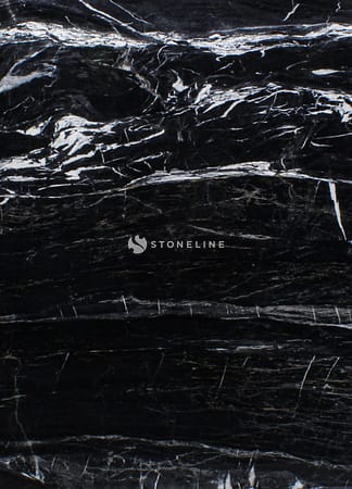 Black marble texture with white veins.