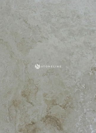 Textured beige marble surface detail.