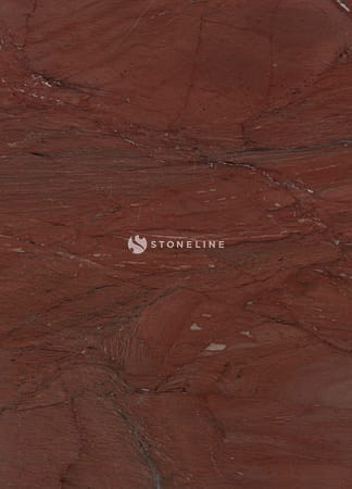 Red marble texture with natural patterns and veins.