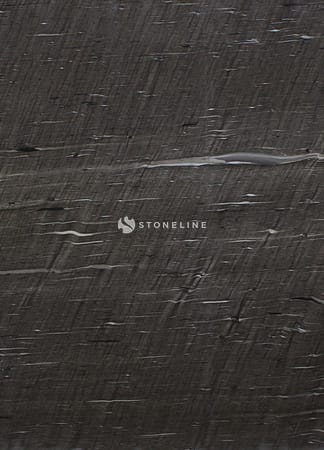 Closeup of dark textured surface.