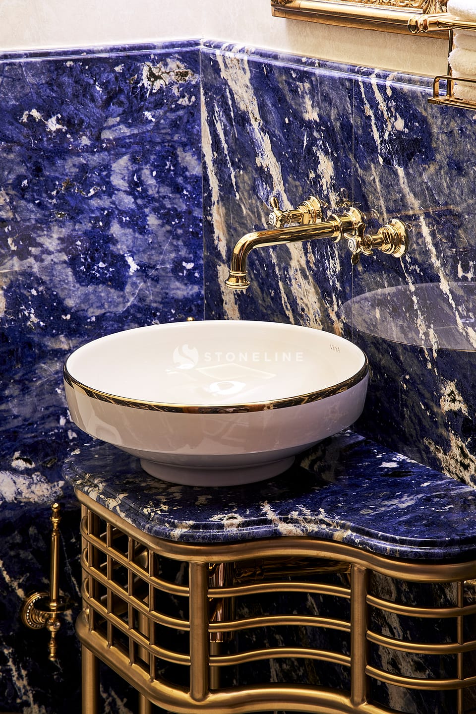 Luxurious blue marble sink and gold faucet