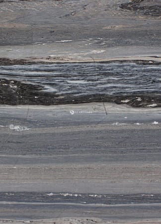 Close-up of gray marble texture with dark veins.