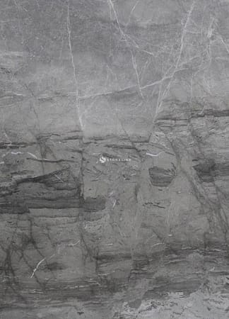 Close-up of gray stone texture with veins.