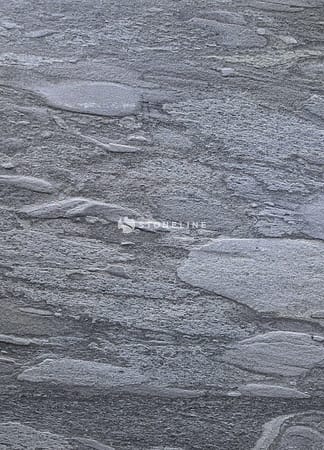 Gray textured rock surface with layered patterns