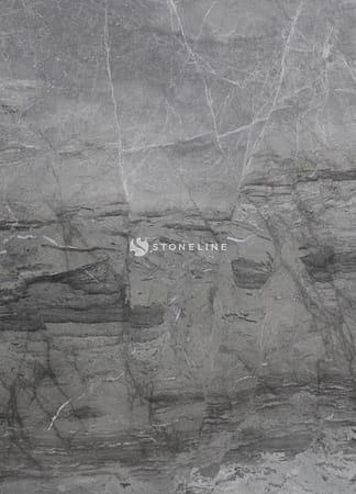 Close-up of gray stone texture with veins.