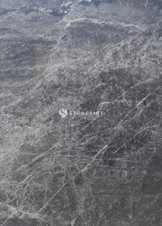 Close-up of textured gray stone surface.