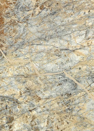 Close-up of multicolored marble texture with veins.