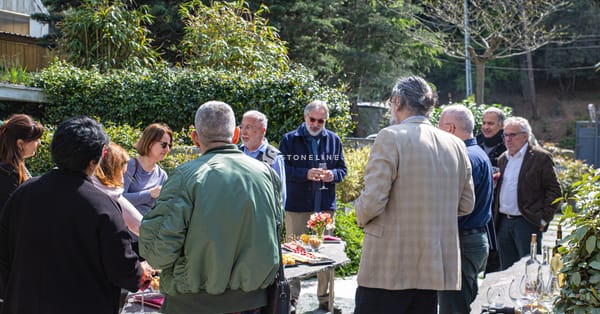 Group outdoors enjoying food and conversation