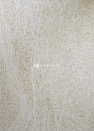 Close-up of textured light marble surface.