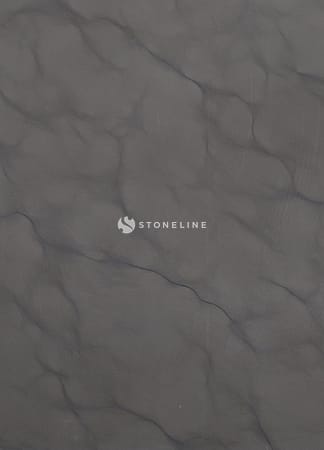 Close-up of dark stone texture pattern.