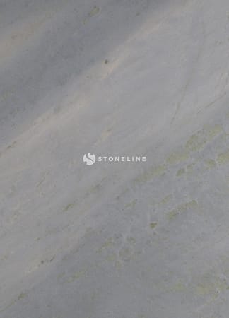 Textured gray and green stone surface close-up.