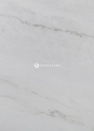 Close-up of white marble texture with veins.